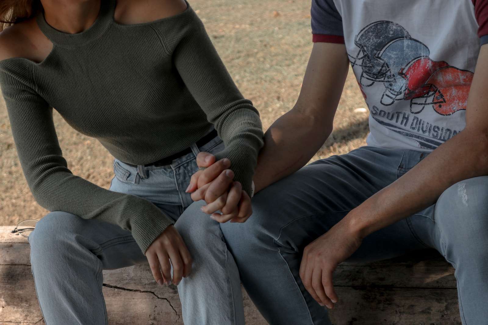 How to talk to a loved one who is Struggling Emotionally woman in gray long sleeve shirt and gray pants sitting on brown wooden bench