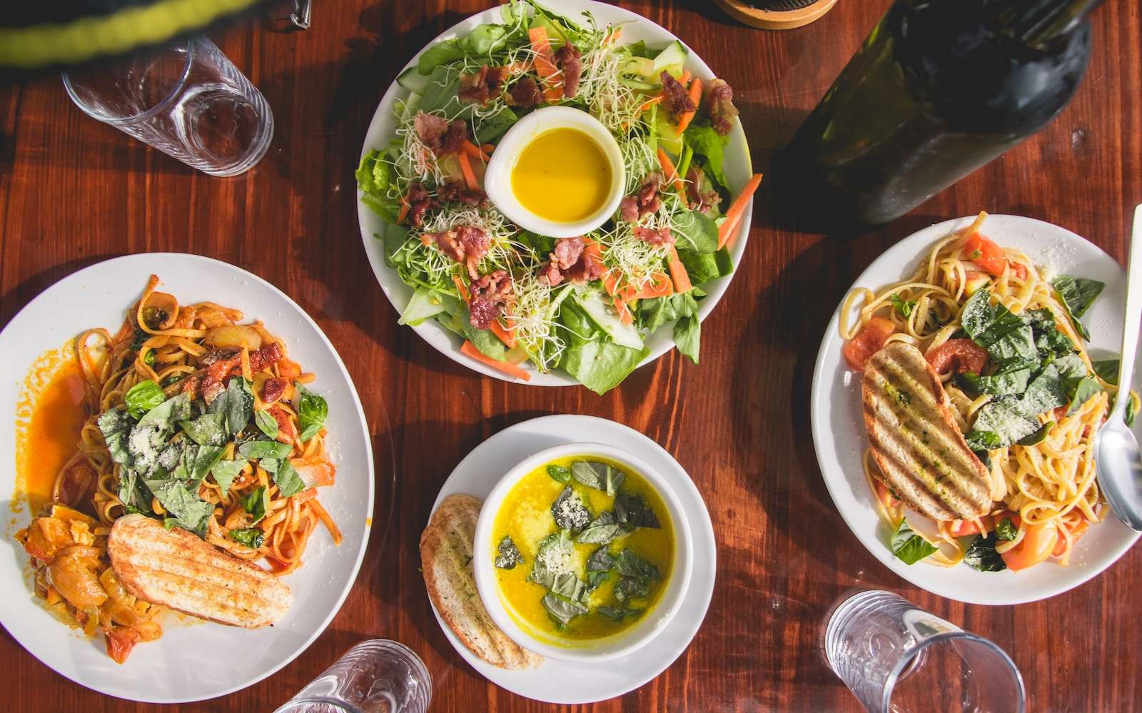 Size matters - four assorted dishes on wooden surface