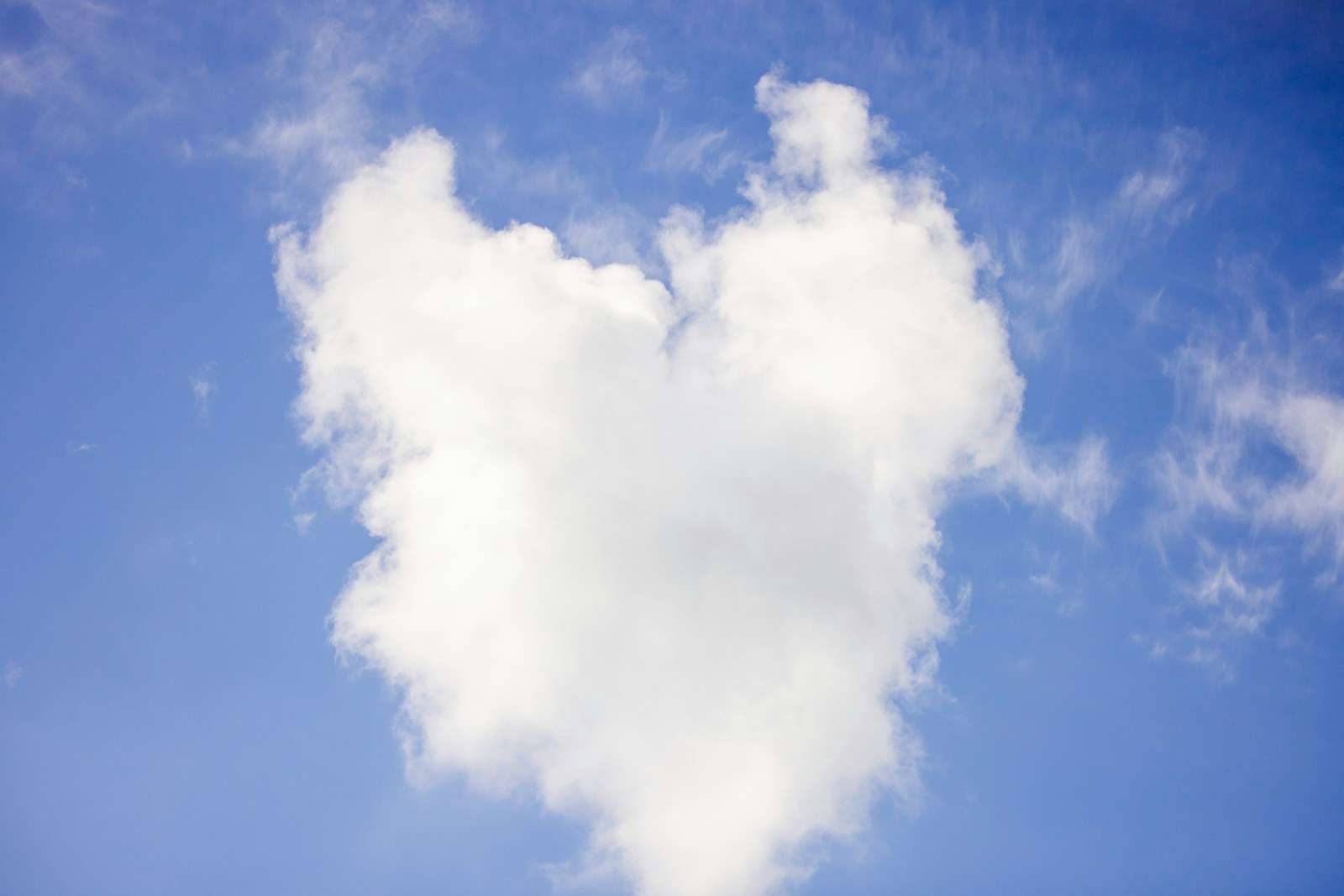 Cloud 9 a heart shaped cloud in a blue sky