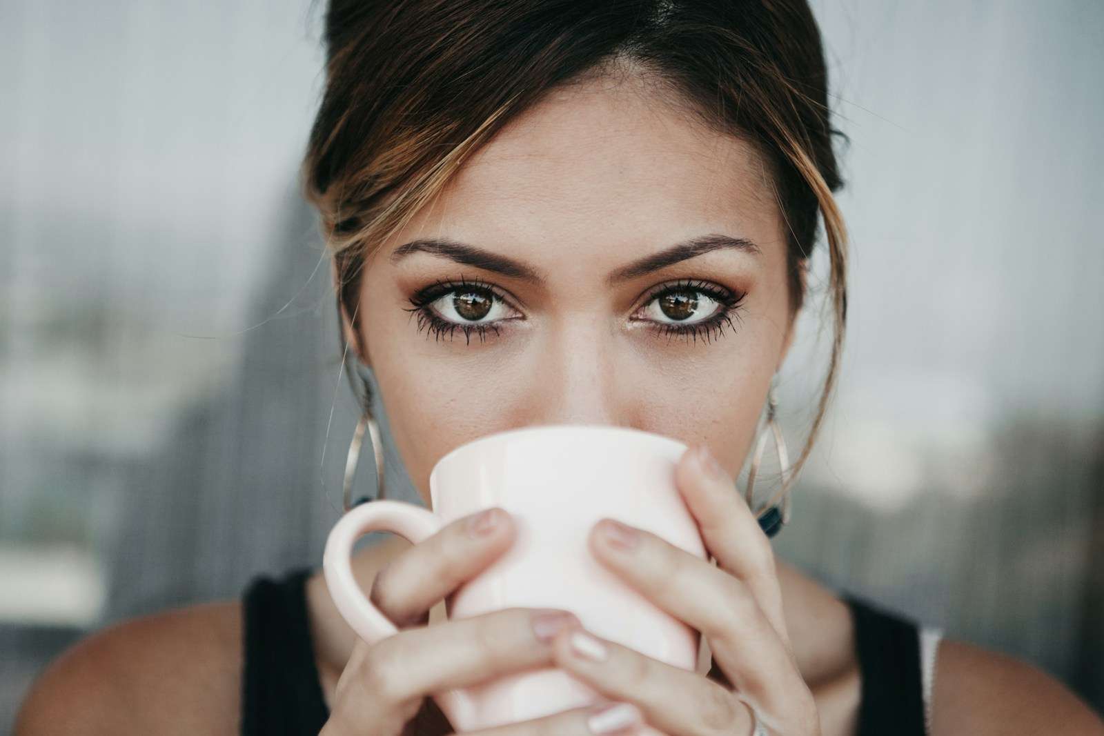 what women do woman drinking from white coffee cup