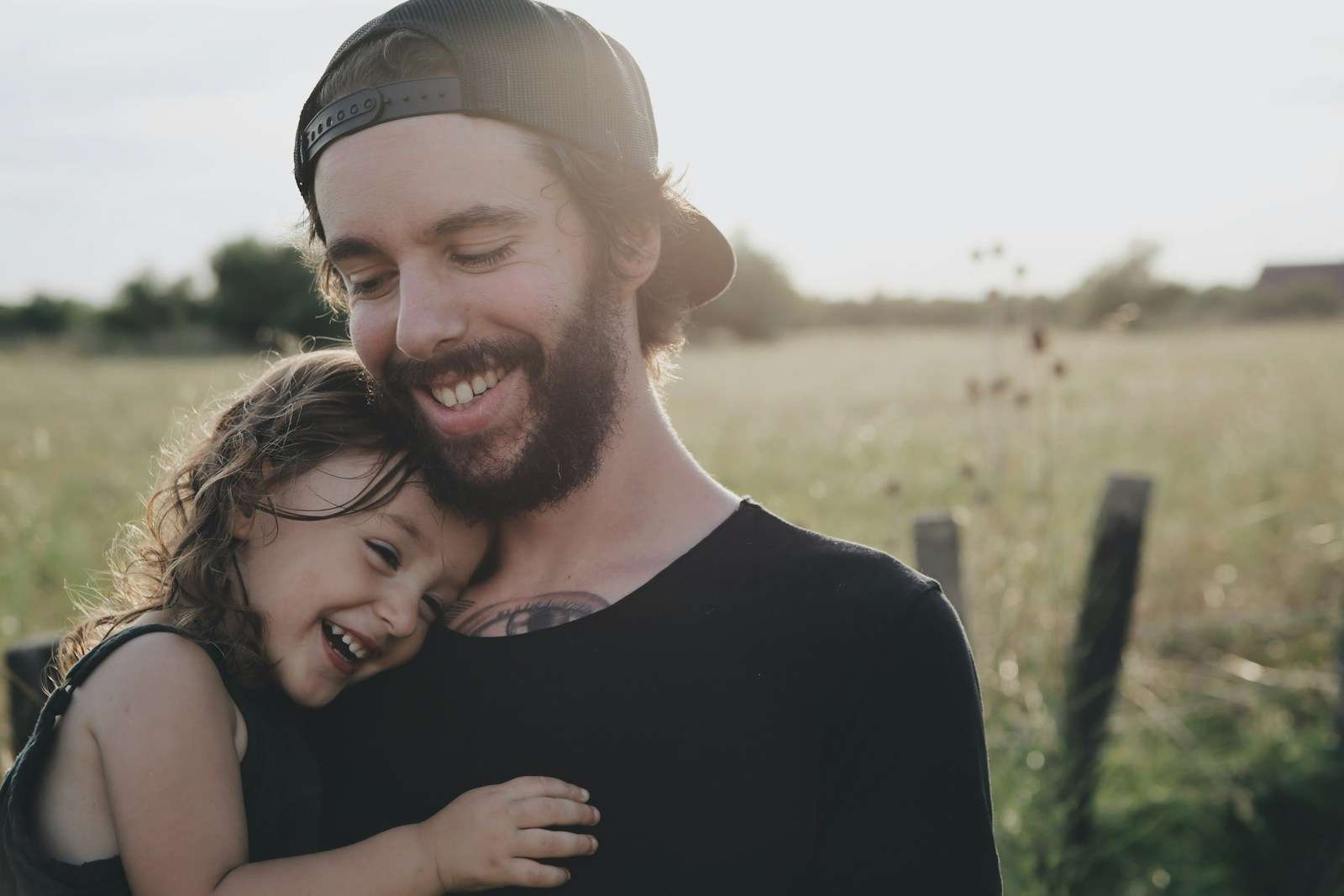 Wellness After a Vasectomy: What to Expect and How to Adjust man carrying daughter in black sleeveless top