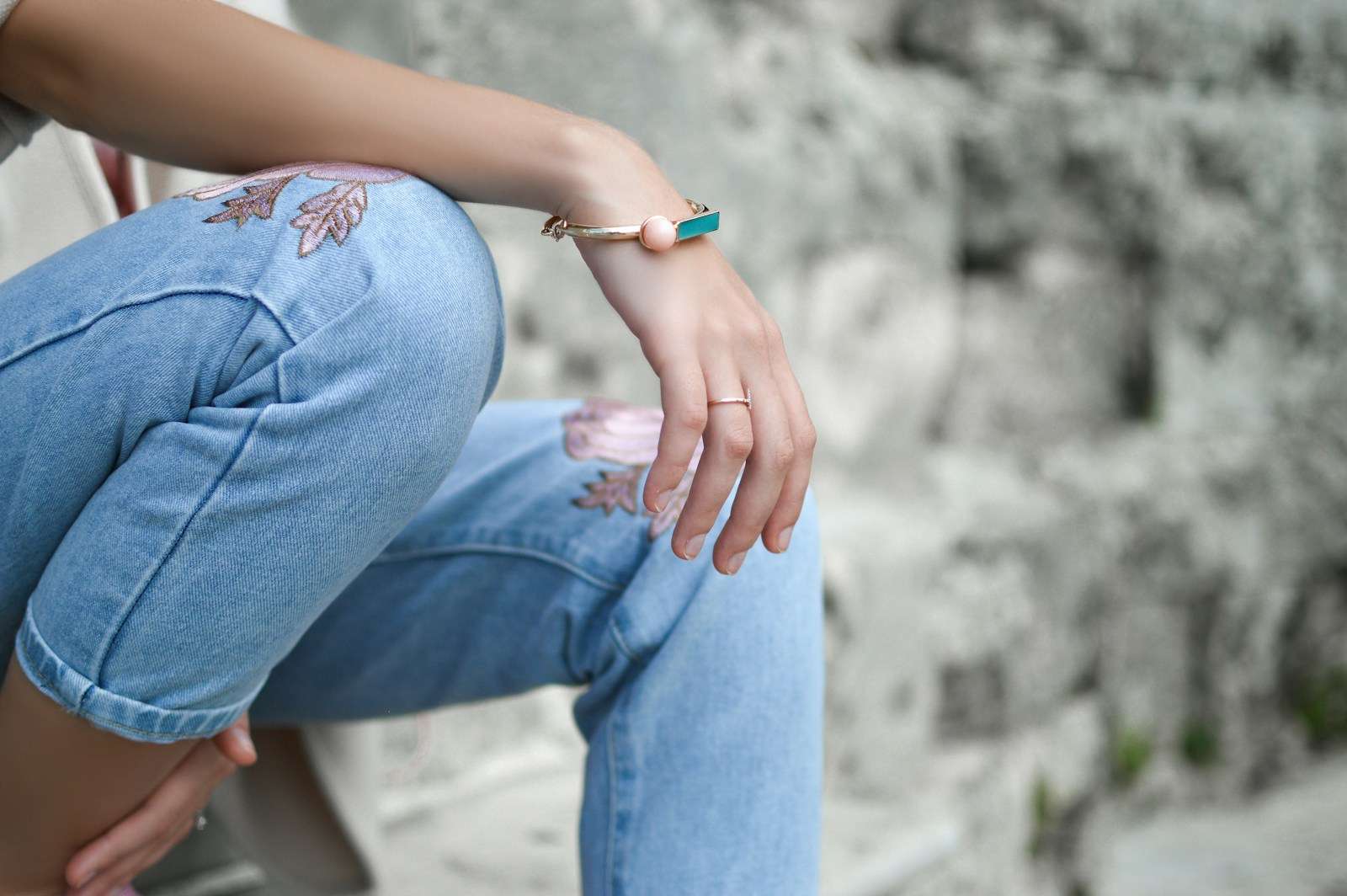 How Jewellery Continues to Empower Women shallow focus photography of woman sitting on stair