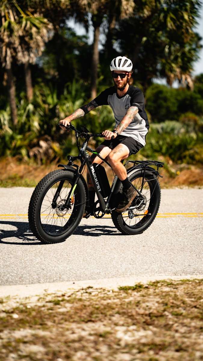 Ebikes a man riding a bike down a street
