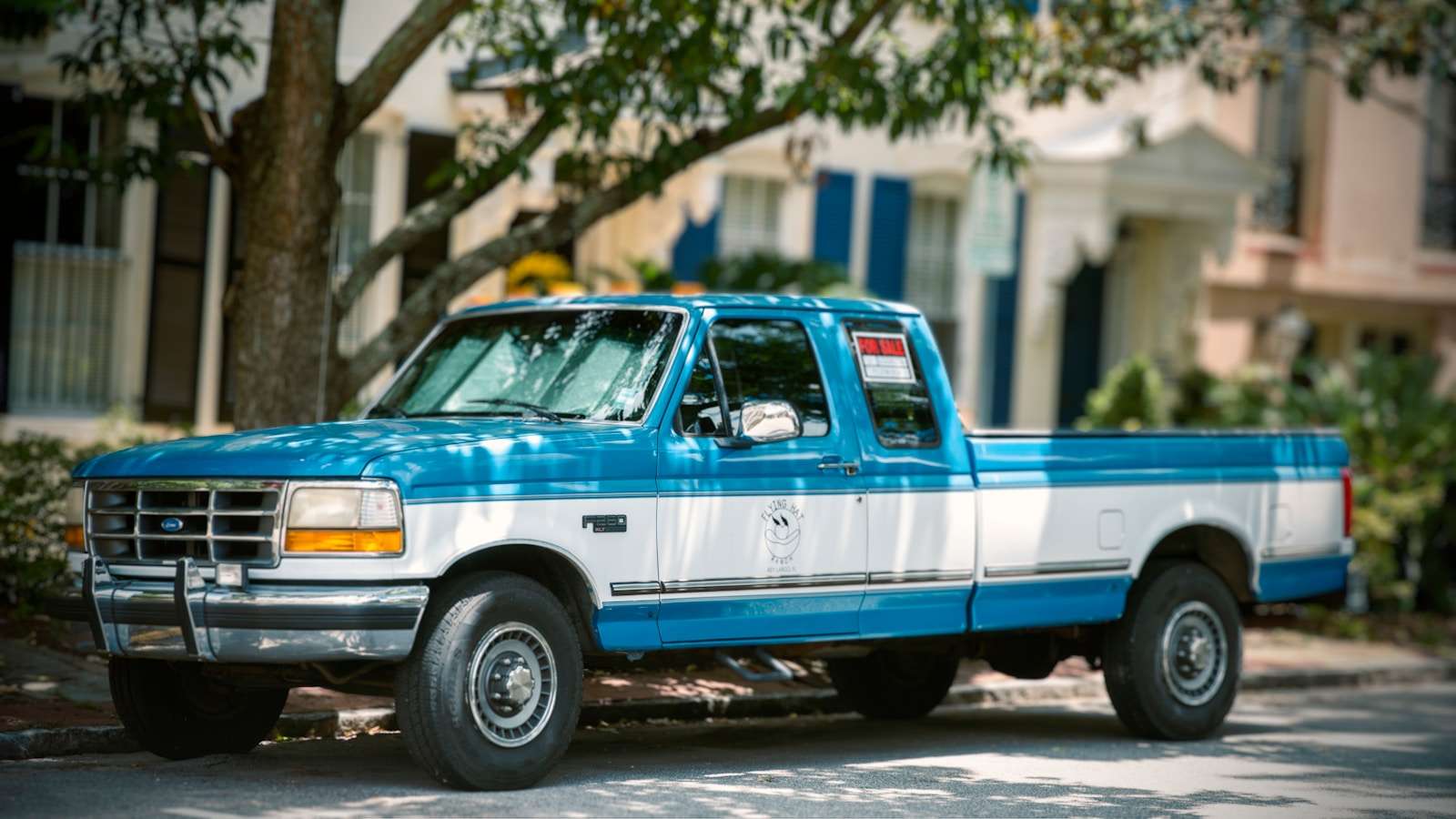 Used pickup trucks a blue truck parked on the side of the road