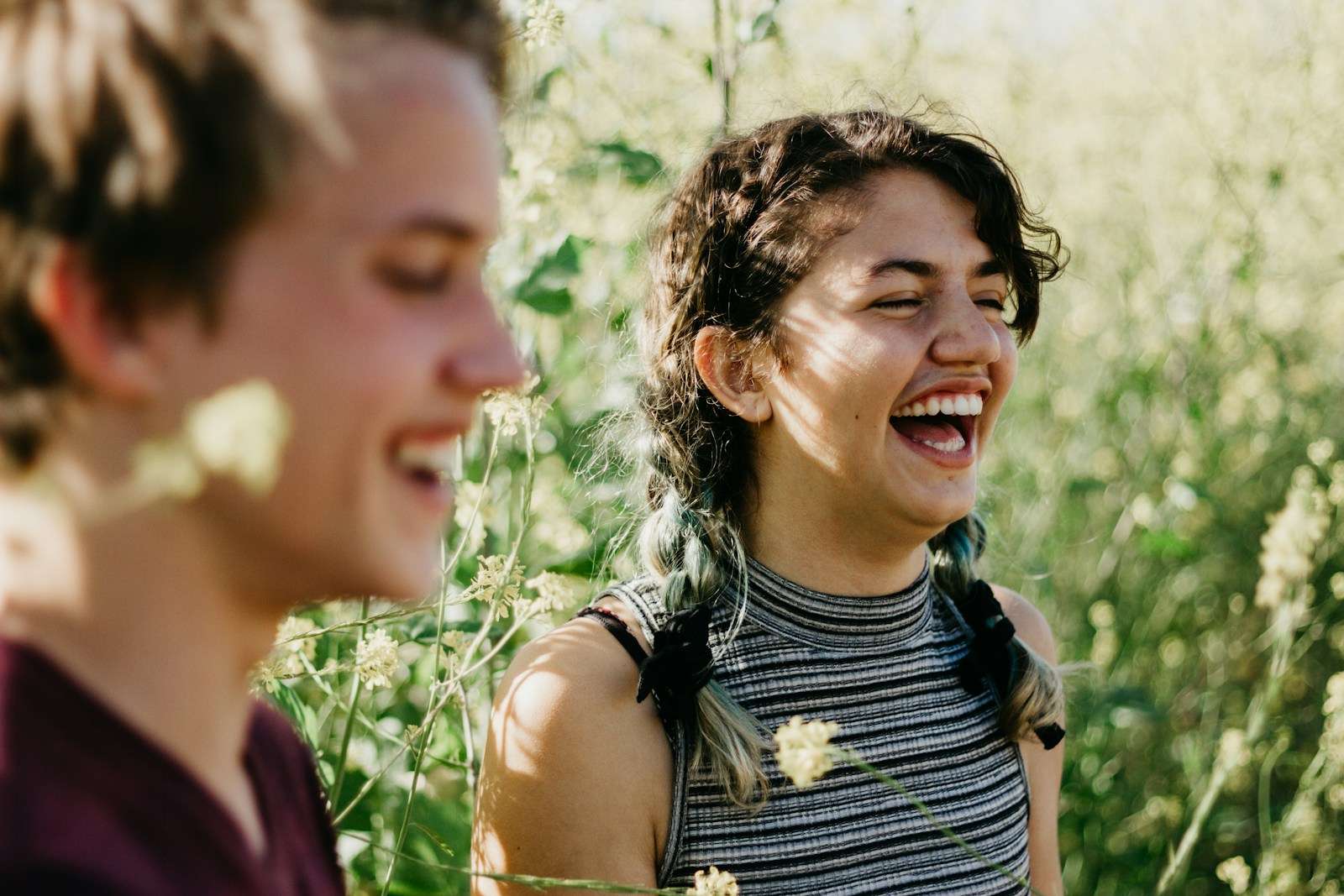 Swearing is good for the soul WTF man and woman laughing surrounded with green grass during daytime