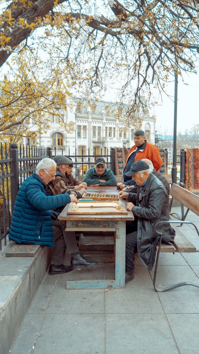 Finding Peace of Mind: What Good Memory Care Really Looks Like group of men sitting beside table under yellow leafed tree