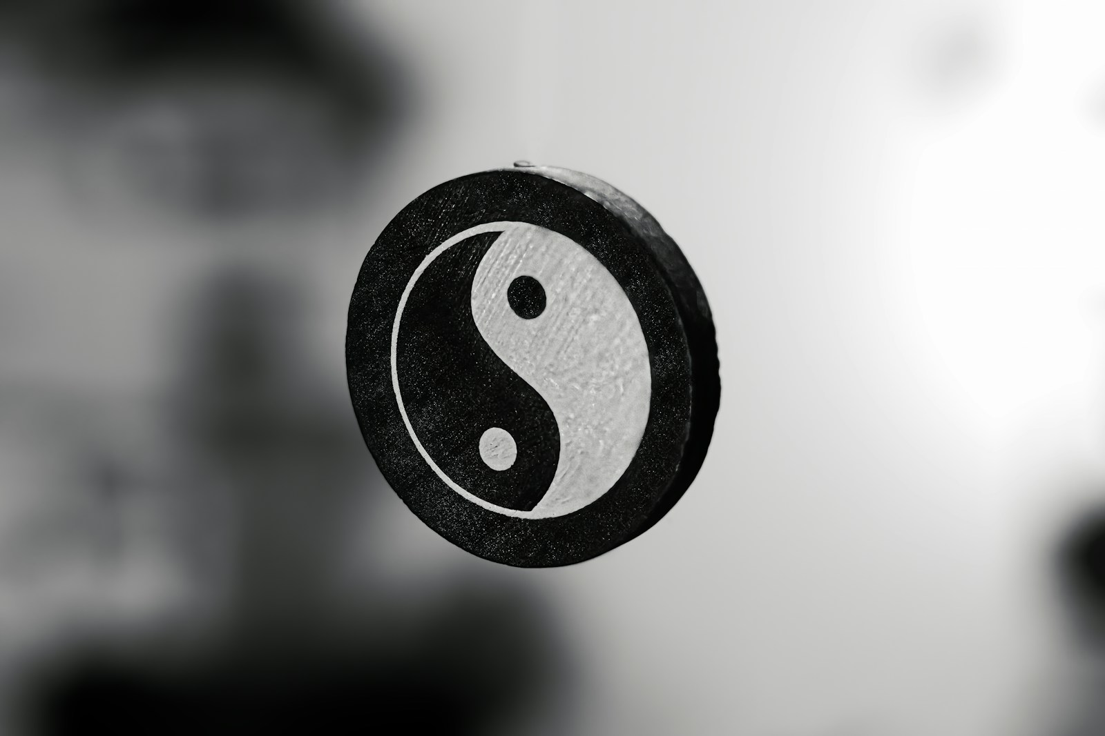 Who is right optimist or pessimist A black and white photo of a yin sign