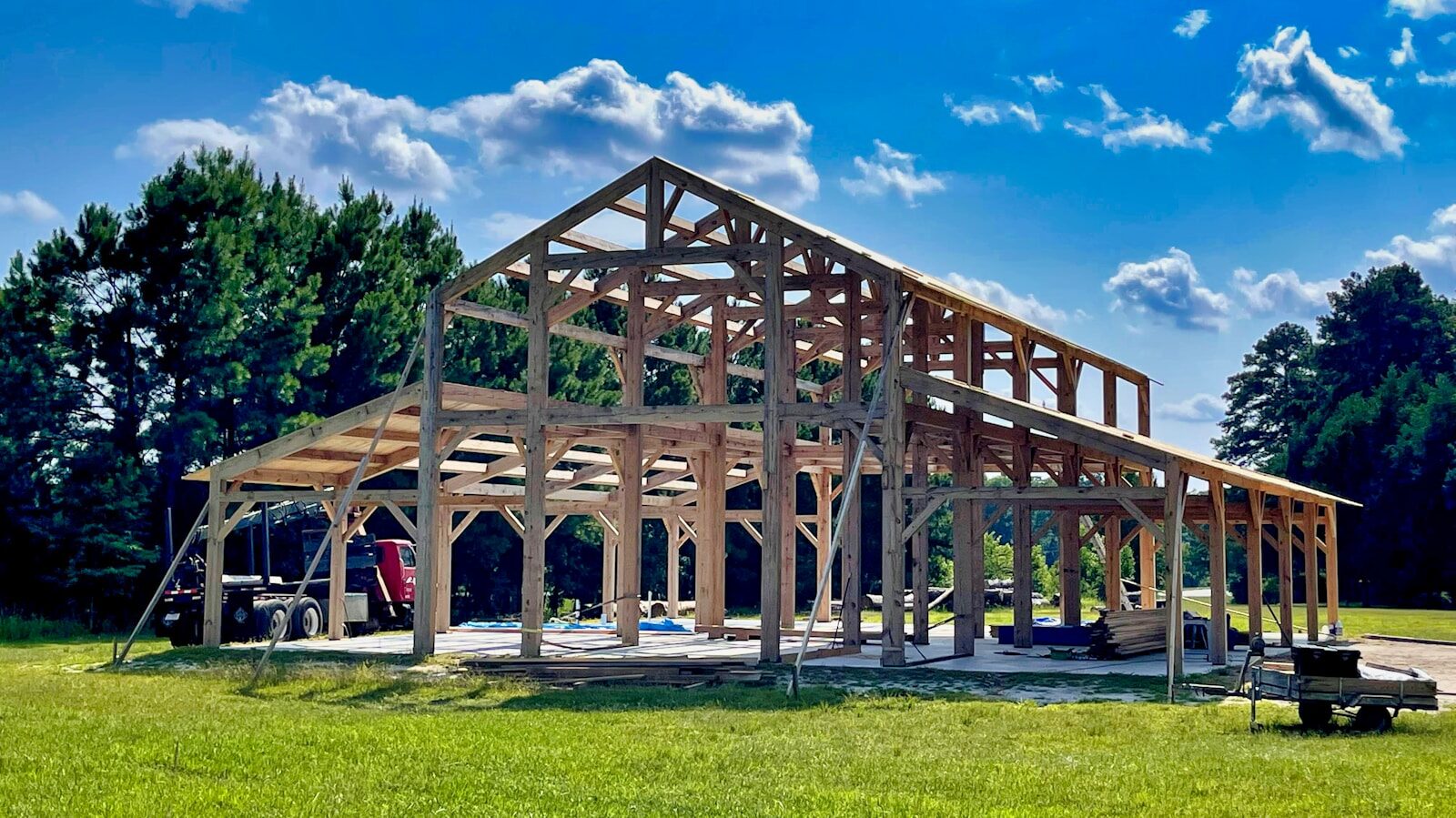 Is Timber-Frame Worth It? We Compared High-Quality Timber Frame Barns to Modern Prefab Options brown wooden building on green grass field during daytime