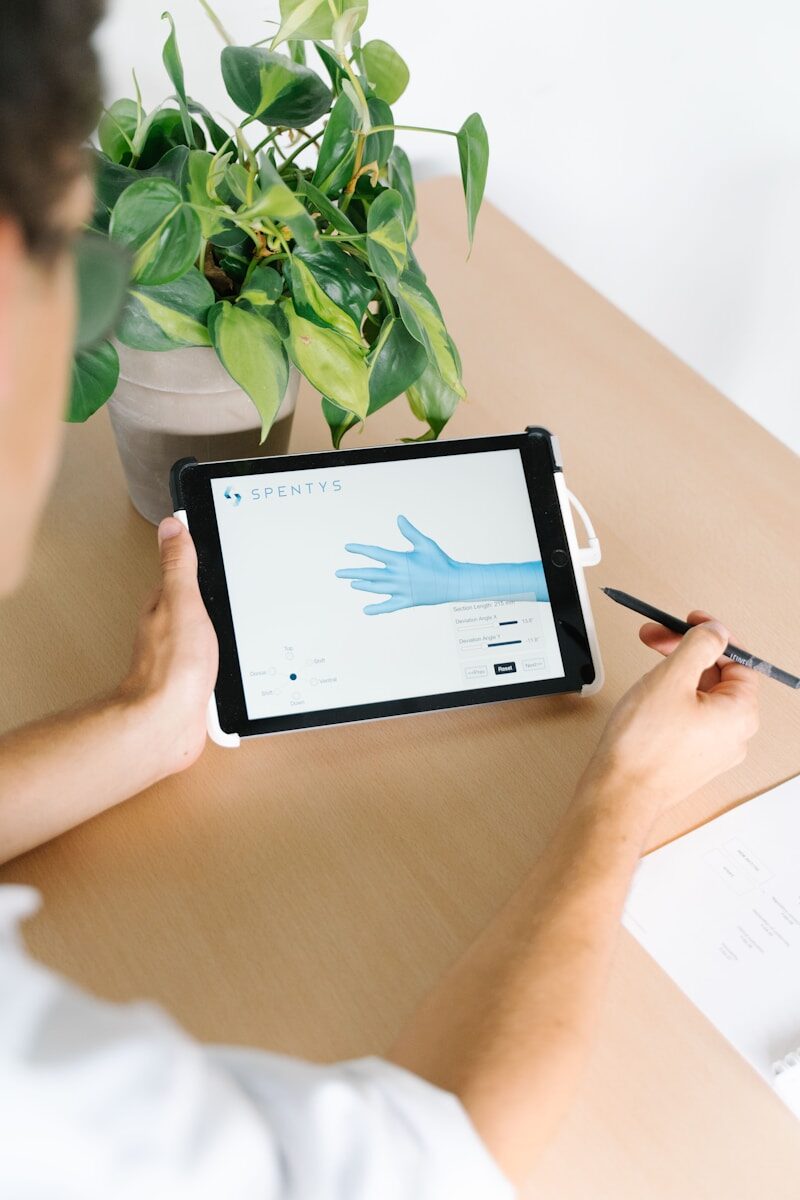 The Rise of Digital Health: Where Does SaMD Fit In? person holding black ipad on brown wooden table