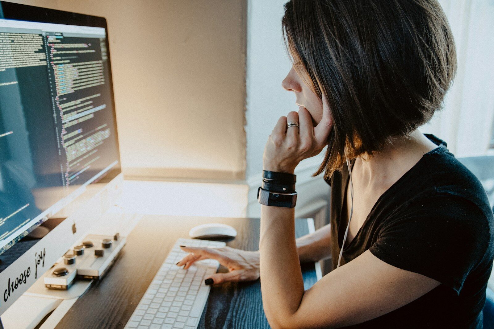 How Postural Changes Influence Daily Life woman wearing black t-shirt holding white computer keyboard
