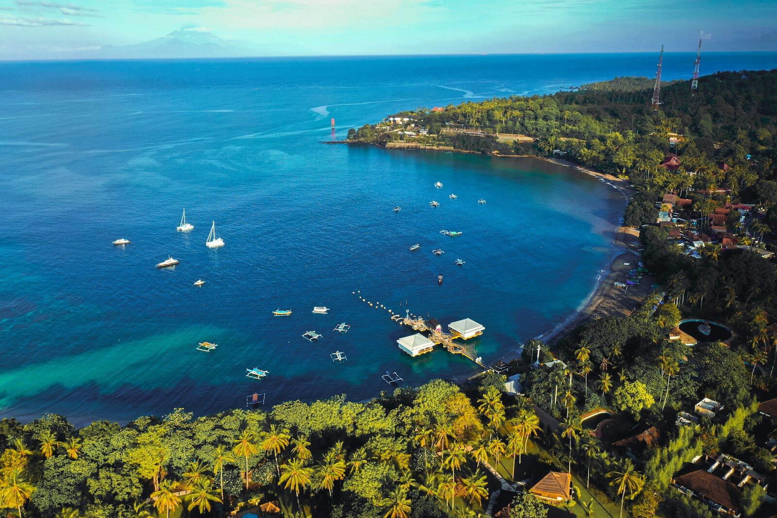Qunci Villas: A Serene Guide for Enjoying Sunsets in Senggigi aerial view of green trees and body of water during daytime