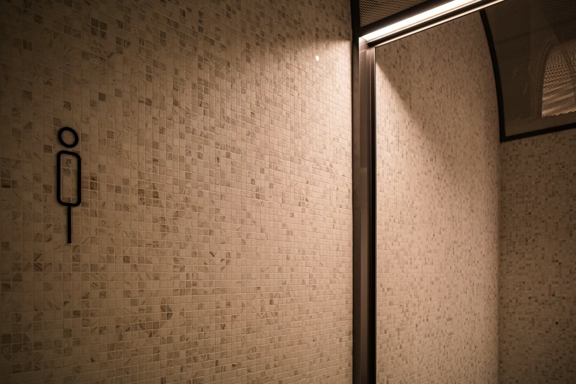How to Tile a Bathroom Wall Yourself Without Ruining It