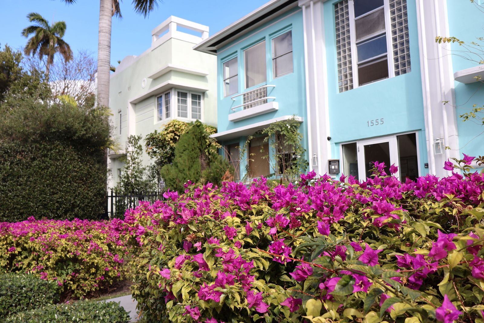 How to Sell Your House Fast in Orange Park, FL: A Complete Guide for Homeowners Art Deco architecture with vibrant bougainvillea in a sunny garden setting.
