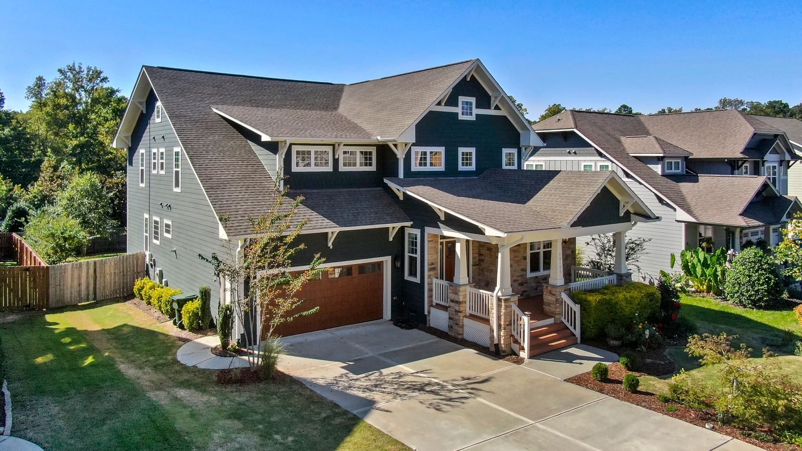 How to Fast-Track Your Garner Home Sale Successfully A beautiful Craftsman-style house with a spacious porch and manicured lawn in Raleigh, NC.