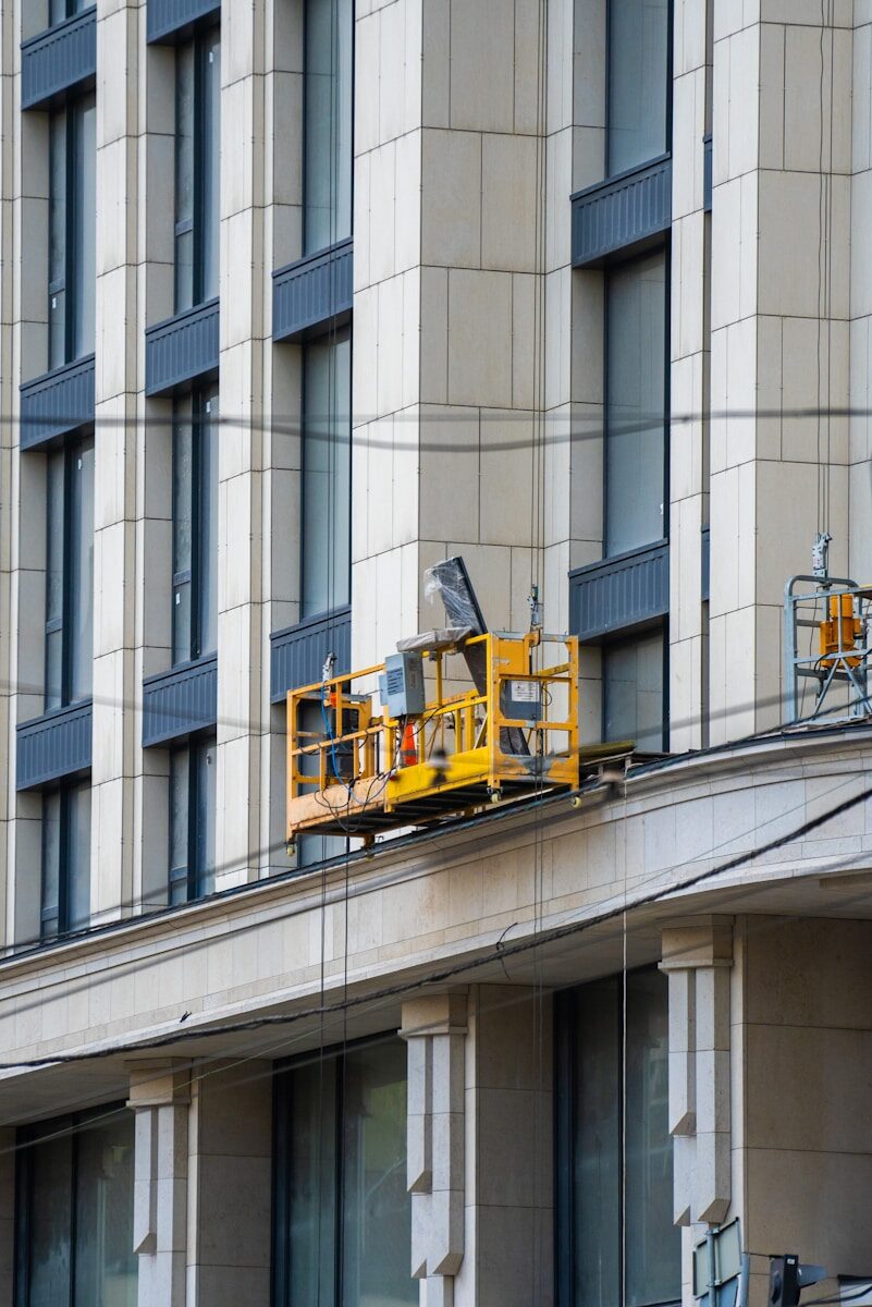 The Biggest Maintenance Mistakes Commercial Property Owners Make yellow and black train on gray concrete building during daytime