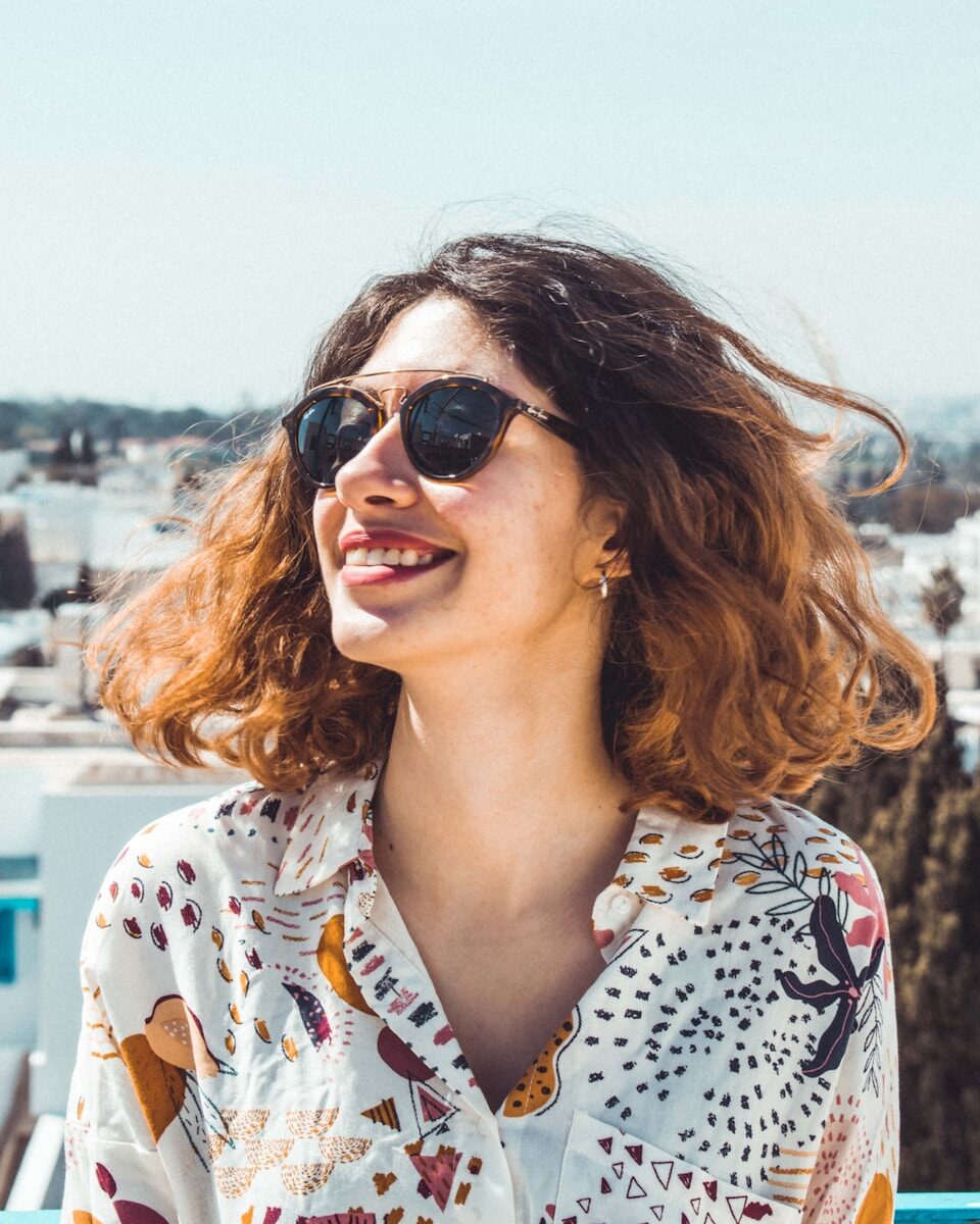 How a Smile Transformation Can Boost Your Confidence woman in white and yellow collared top