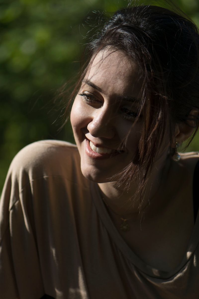 Revolutionizing Facial Rejuvenation: The Role of Injectables in Modern Aesthetics A joyful woman enjoying the sunlight outdoors, captured in natural lighting.
