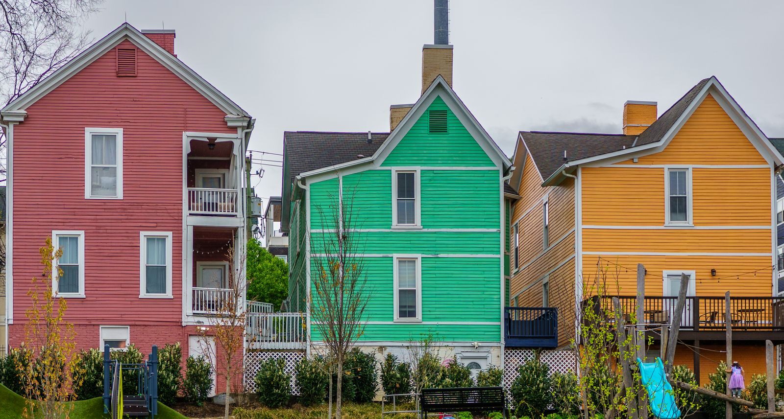 How to Sell Your Home Fast in Collierville, TN: Proven Strategies for 2026 Brightly colored houses in Knoxville, Tennessee neighborhood on a cloudy day.
