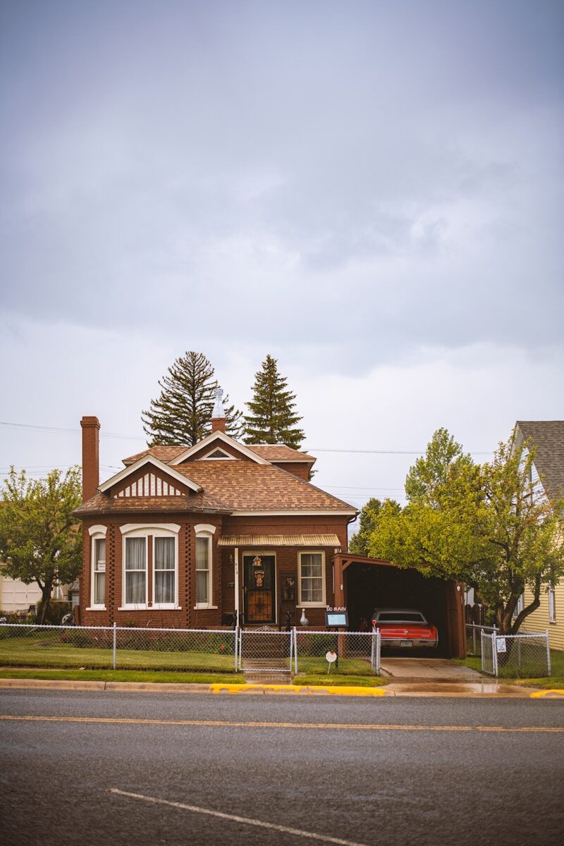 Selling Your Home in Roundup, MT: Proven Strategies for a Fast and Efficient Sale brown and white house near green trees under white sky during daytime