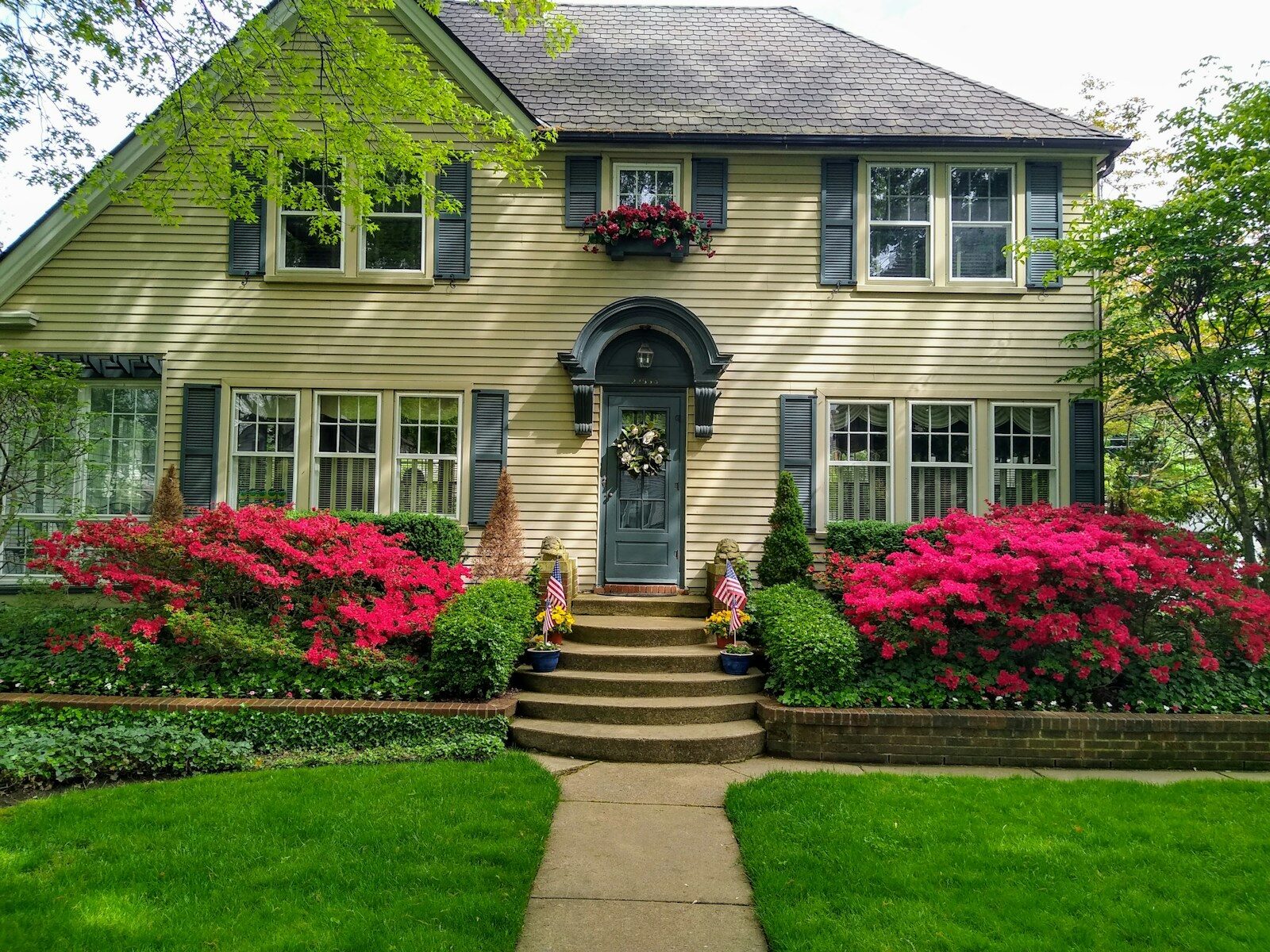 How to Prepare Your Home for a Quick Sale in Terrell, Texas gray concrete house with red flowers on the side
