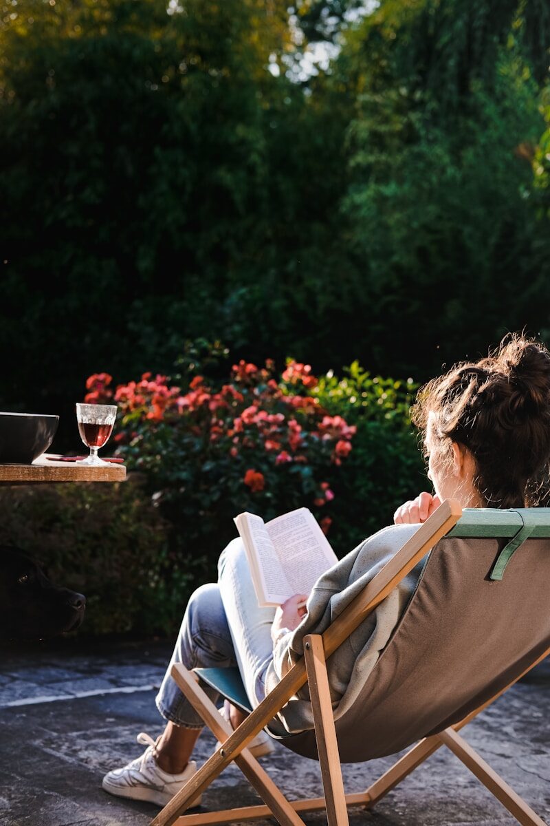 Why Holistic Detox Requires Healing Both Mind and Body a person sitting in a chair reading a book