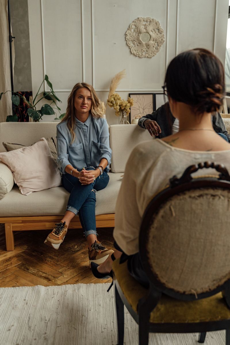 Working From Home While Prioritizing Mental Health: A Practical Recovery Guide A therapist and client in discussion during a cozy indoor session highlighting mental health.