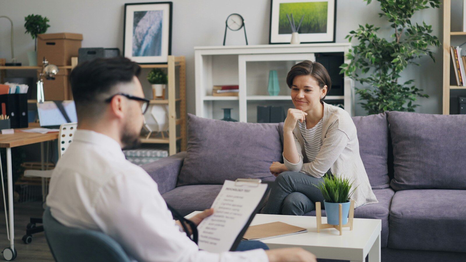 Questions to Ask About Integrated Treatment in Ohio a woman sitting on a couch talking to a man