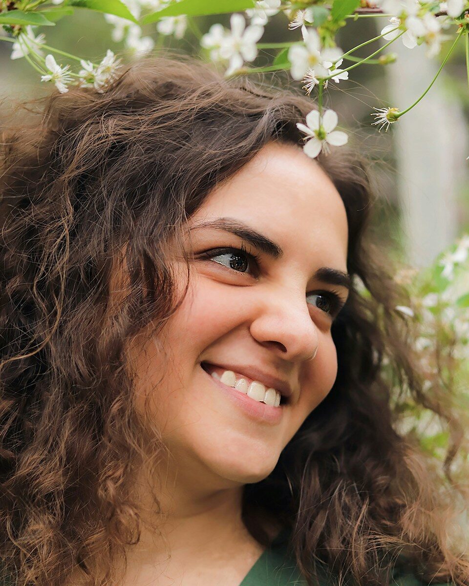 Dentures and the Emotional Side of Restoring a Complete Smile woman with brown hair smiling