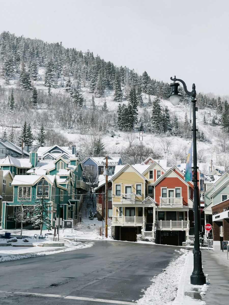 Frozen Main Lines: Winter Prevention Guide for Salt Lake City Property Managers Booking a Drain Cleaning Service in Salt Lake City, UT a row of houses in the snow